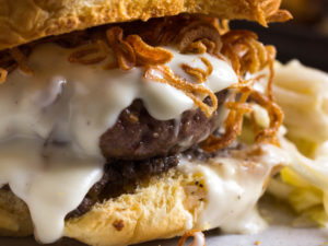 Photo of burger with onion crisps